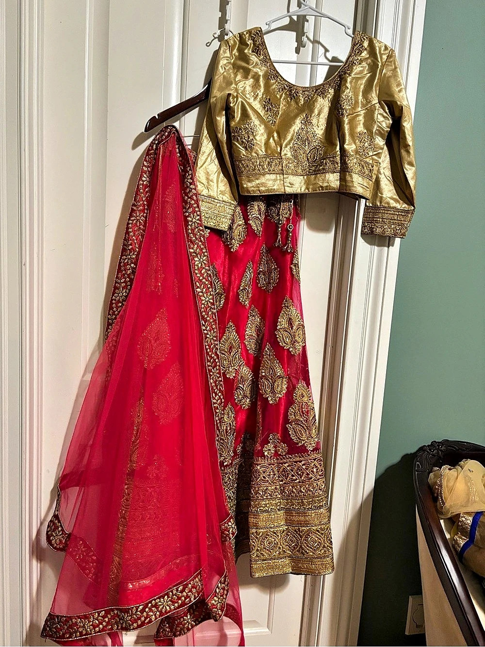 Designer wedding 3 piece Lehenga skirt, full sleeve blouse and duoetta. Red Gol